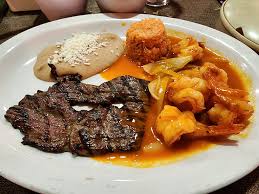 La Gran Diabla Restaurant signature dishes Mar Y TierraEl Gran MolcajeteNatural Flaming Cheetos